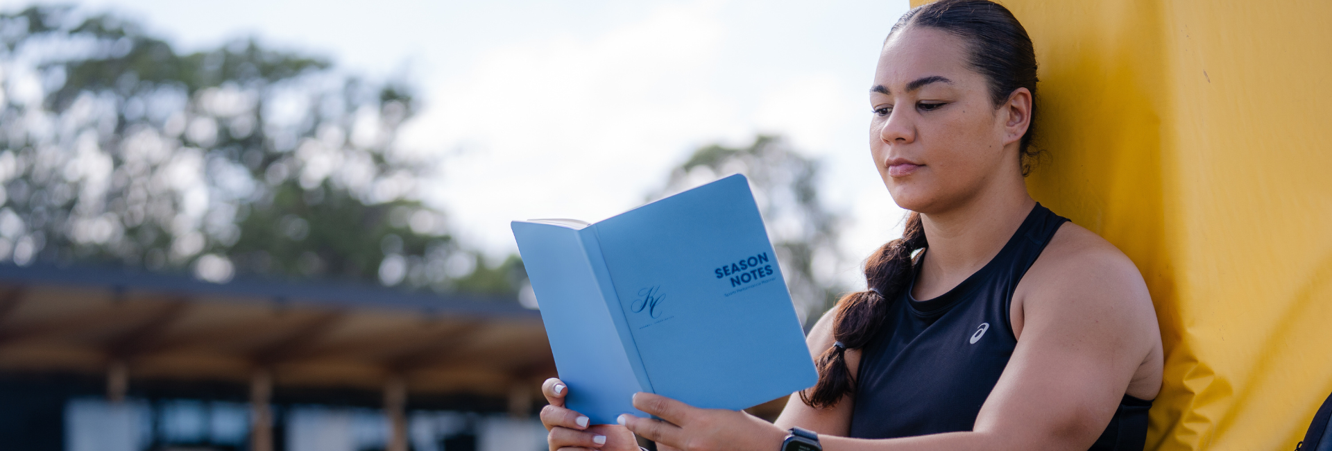 Kennedy Cherrington Professional League Player holding Season Notes Journal